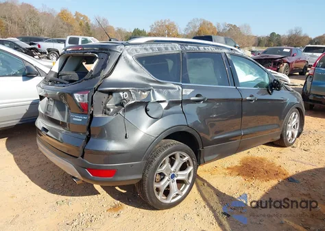 2017 Ford Escape Titanium z USA, uszkodzony, nr VIN 1FMCU0J90HUE20484